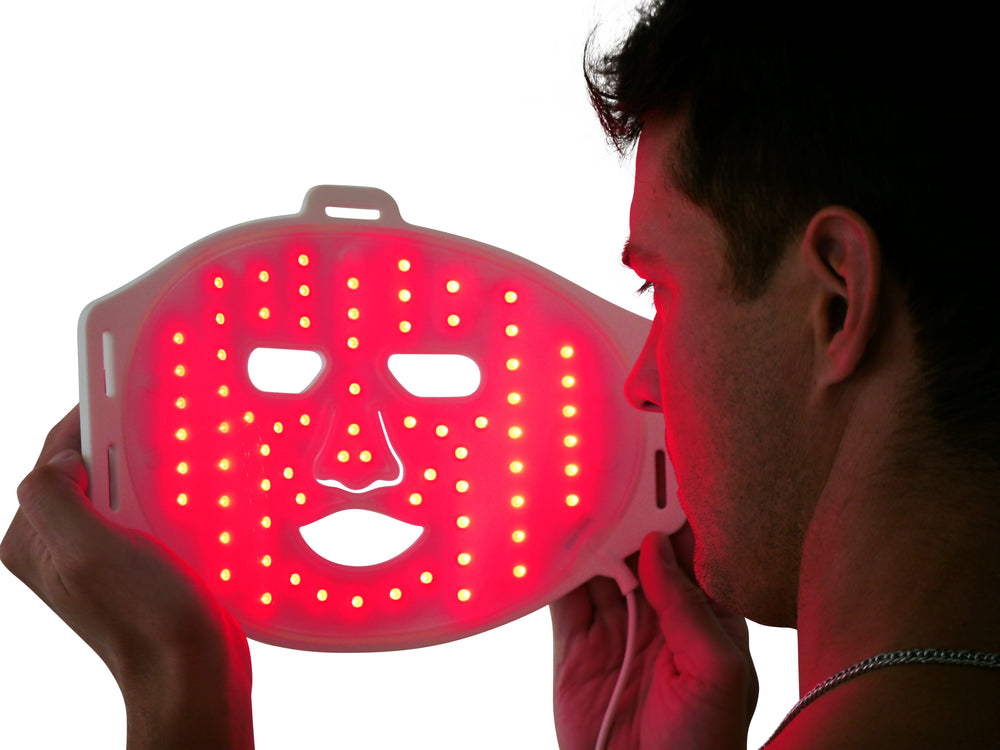 Aura Sweden LED light therapy face mask for skincare and acne treatment, with attached control unit